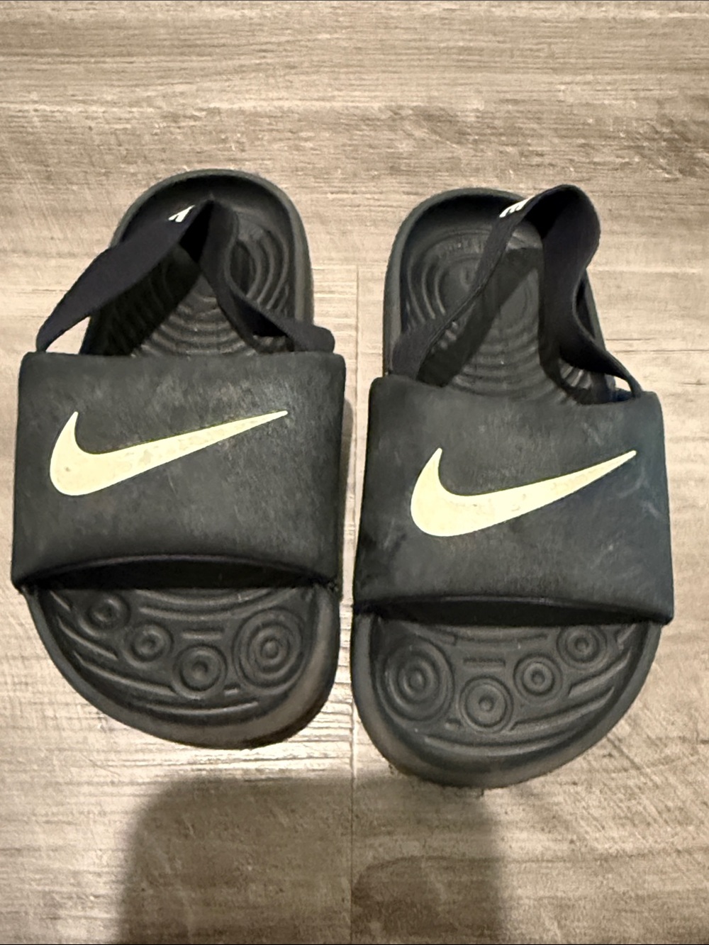 Nike Kids Black Slide Sandals with White Swoosh Accent